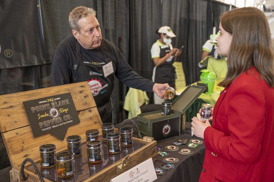 A guest tastes a sample of Smoke Rings by Point Blank Pepper Co. at The Classic Center
