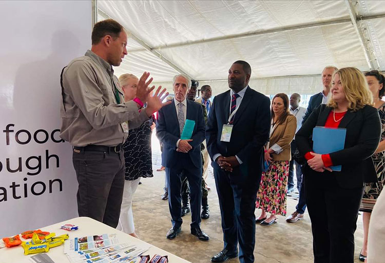 Peanut Innovation Lab Assistant Director Jamie Rhoads explains a point to Ireland’s ambassador to Malawi, Seamus O’Grady; Malawi’s minister of agriculture Sam Kawale; and the U.S. Embassy in Malawi’s chargé d’affaires Amy Diaz at the third day of the 2024 Groundnut Tour in Malawi.